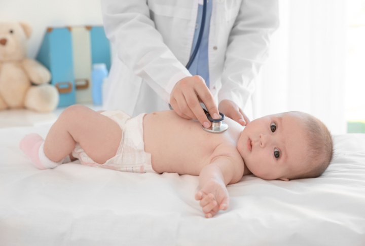 Doctor,Examining,Little,Baby,With,Stethoscope,In,Clinic.,Baby,Health
